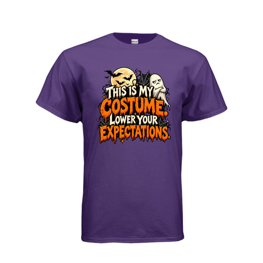 Purple This Is My Costume Lower Your Expectations Halloween graphic with grumpy ghost, bats, glowing moon, spiderwebs, and orange and white lettering.